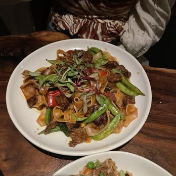 Elephant East signature dishes Crispy Rock Shrimp, Pork Belly Bao, Drunken Noodles, Singapore Noodles